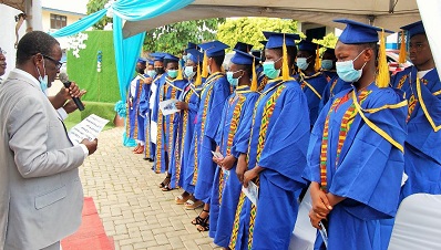 Mr Dzamesi (right) performing the graduation for the past students