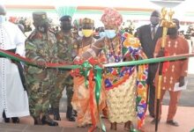 • Inset,Naa Odarkai Odzjalawa I(second from right) being assisted by Maj-Gen Peprah(second from left) and other dignitaries to cut the tape to inaugurate the facility Photo: Victor A. Buxton