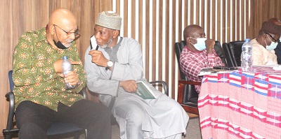 • .Dr Mohamed-Sani Abdulai (second from left) interacting with Mr Anis Haffar after the lecture. Photo: Ebo Gorman