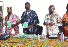 • Dr Mensah-Abrampa (second from right) Mr Kpankpah (middle) with other dignitries with the handbook. Photo: Vincent Dzatse