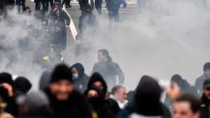 • Police dispersing protesters with tear gas