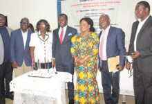 • Mr John Ntim Fordjour (middle) with executive members of the AEITG after cutting the inaugural cake Photo: Ebo Gorman