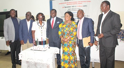 • Mr John Ntim Fordjour (middle) with executive members of the AEITG after cutting the inaugural cake Photo: Ebo Gorman