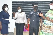Inset, Chief Supt.Owusuwaa Kyeremeh (right) interacting with Ms Hilda Mensah (second from left) after the commissioning. With them include Chief Supt. Cosmos Anyan (second from right) Photo: Victor A Buxton