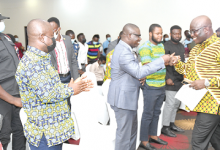 Mr Isaac Adongo exchanging greetings with Mr Eric Opoku (right) after the forum