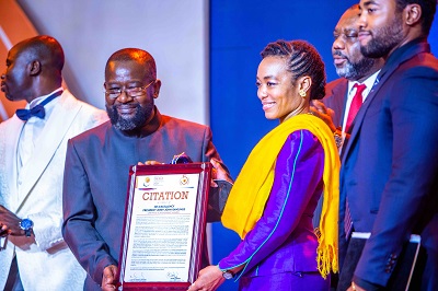 • Dr Agyemang-Rawlings (right) receiving the award from Mr Kwame Jantuah