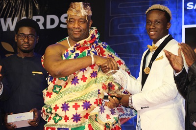 • Takyi (right) receives his award from the Ga Mantse Nii Tackie Teiko Tsuru