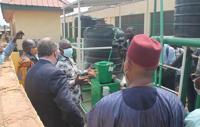 Dr Richard Bayitse(hand stretched) explaining the plant operation to the dignitaries. Photo Godwin Ofosu-Acheampong