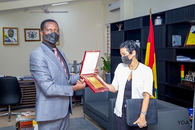 Dr Adutwum (receiving a gift from Mrs Anette Chao Garcia