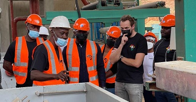 Mr Krapa (3rd from right) inspecting the machinery under installation