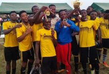 • Players of Ahamansu United celebrating with the championship trophy