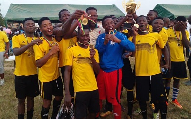 • Players of Ahamansu United celebrating with the championship trophy