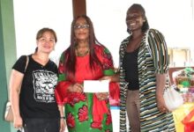 • Madam Commodore flanked by representatives of Beebie Event Ghana