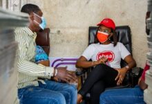 • Mrs Abena Osei-Poku interacting with a customer of the bank