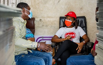 • Mrs Abena Osei-Poku interacting with a customer of the bank