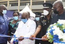 President Akufo-Addo(middle)being assisted by Mr Ambrose Dery (right) and Dr Dampare (second from right)to cut the tape to commission the Virtual Medical Center Photo Anita Nyarko-Yirenkyi