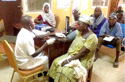 • A health official examining a woman during the exercise