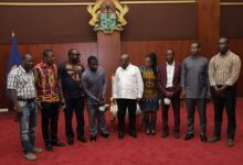 President Akufo-Addo (middle) with beneficiaries of AOGC and management of Petroleum Commission after the program