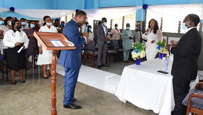 Dr Lawrence Tetteh (left)addressing the staff of NTC during the service .With him are Mr Mr Martin-Adu-Owusu,MD,NTCand Empress Gifty Photo: Victor Buxton