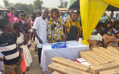 • Ms Linda Akweley Ocloo (middle) about to present some of the items to beneficiaries