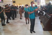 • Personnel of GIS dancing to music at the church service