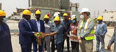 • Inset: Mr Francis Kofi Kpolu, Country Director of Ameri, handing over the keys of the power plant to Mr Owereko Aidoo