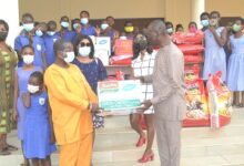 • Mr Isaac Arthur (second from left) receiving the items from Mr Kingsley Asah Photo: Victor A. Buxton