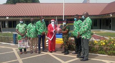 Capt. Duah (first from left), presenting a hamper to Flying Officer Degamus