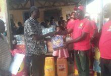 •Mr Adofo (second from right) presenting the items to Mr Owusu