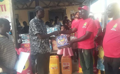 •Mr Adofo (second from right) presenting the items to Mr Owusu
