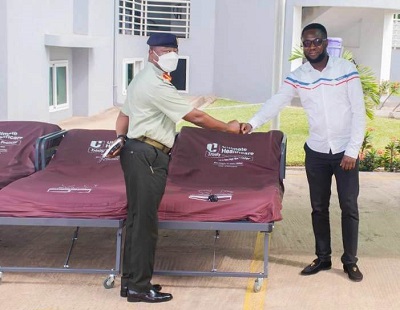 Mr Yebaoh (right) presenting the beds to Brig. Gen Agyeman-Prempeh