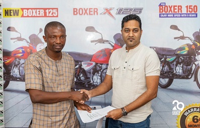 Mr Ntiamoah-Boakye (right) exchanges the MoU with Mr. Sharma