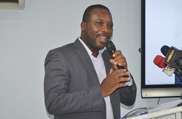 Mr Bernard Anaba (inset) speaking at the programme Photo Victor A. Buxton