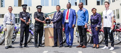 • Inset: Mr Salem Kalmoni (fifth from right) presenting helmet and keys to the motorcycles to COP Yohuno (third from left). With them are some dignitaries.the motorcycles to COP Yohuno (third from left).With them are some dignitaries