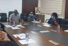 Dr Awal (middle) in a round table discussion with the staff
