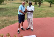 Hans DeBeer (left) receiving his prize from Mr Aggrey