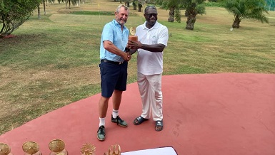 Hans DeBeer (left) receiving his prize from Mr Aggrey
