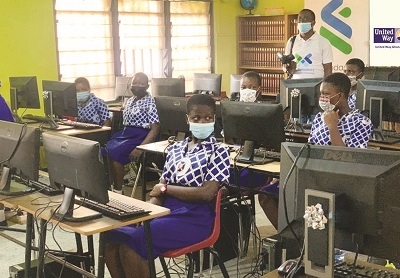 • .Some students seated behind the deskstop computers after the donation
