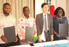 Ambassador Mochizuki Hisanobu (second from right) with the beneficiaries reps after the signing. Photo. Ebo Gorman