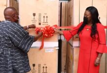 • Mr Agyeman-Manu (left) with Mrs Obo-Nai cutting the tape to receive the equipment