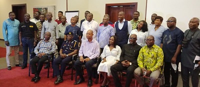Mr Asaki (seated right) with Mr Kyei (seated second left) Dr Obeng (seated second right) and other stakeholders after the forunm