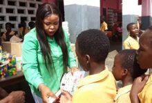 Ms Garglo distributing the items to the pupils