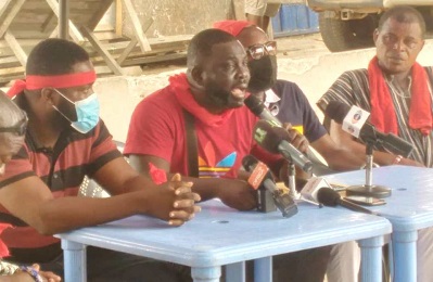 Reginald Nii Lartey Opintan(second from left) addressing the media