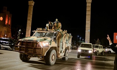 Members of the military personnel arrive to take part in a parade calling for parliamentary and presidential elections