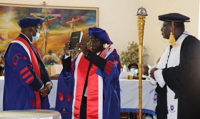 Prof. Oduro-Owusu being sworn into office by the Moderator of the PCG