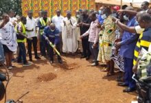 Mr Kyei Mensah-Bonsu cutting the sod for the construction yesterday. Others looking on include Dr Ben Asante looking