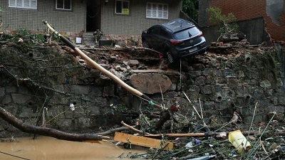 Cars and entire homes were swept away by the floodwaters