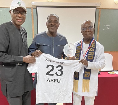 Dr Owusu-Ansah (right) posing for the cameras after his investiture with Prof Omotayo (left) and Dr Ofosu-Asare