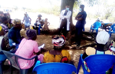 Dr Juwerie (in white gown) interacting with some of the women at the screening exercise