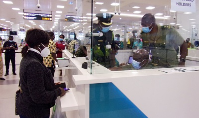 A passenger going through the Ghana Card proccess on her arrival at the Airport Photo Michael Ayeh